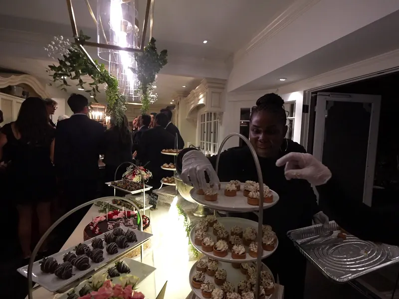 Tiered stand of chocolate-dipped strawberries and pastries at a Martinez celebration