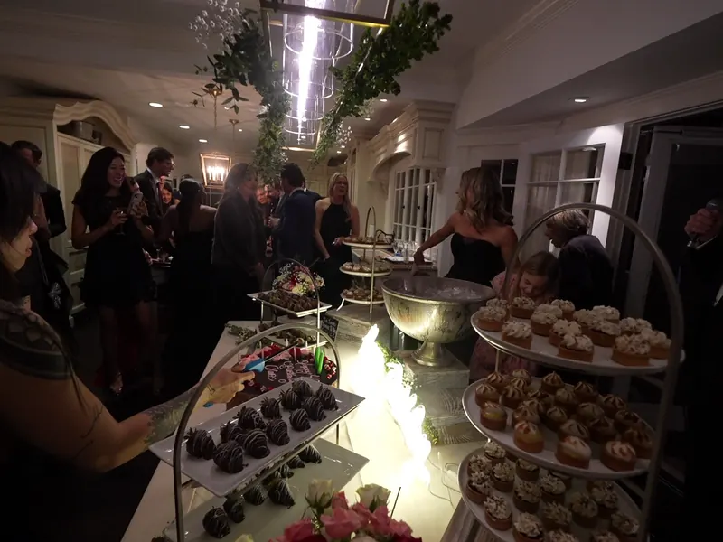 Dessert tower with chocolate-dipped strawberries at a Clayton party