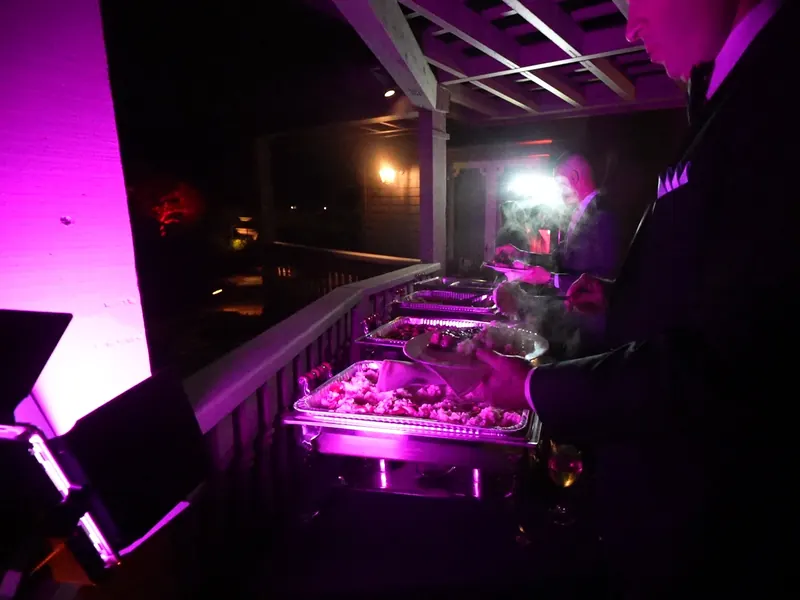 Buffet under a pergola lit for an evening event in Orinda