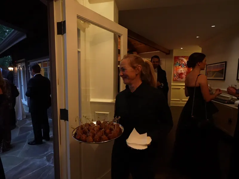 Server passing an appetizer tray at an indoor Lafayette reception