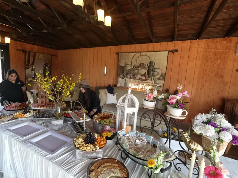 Grazing table with florals and platters at an Antioch celebration