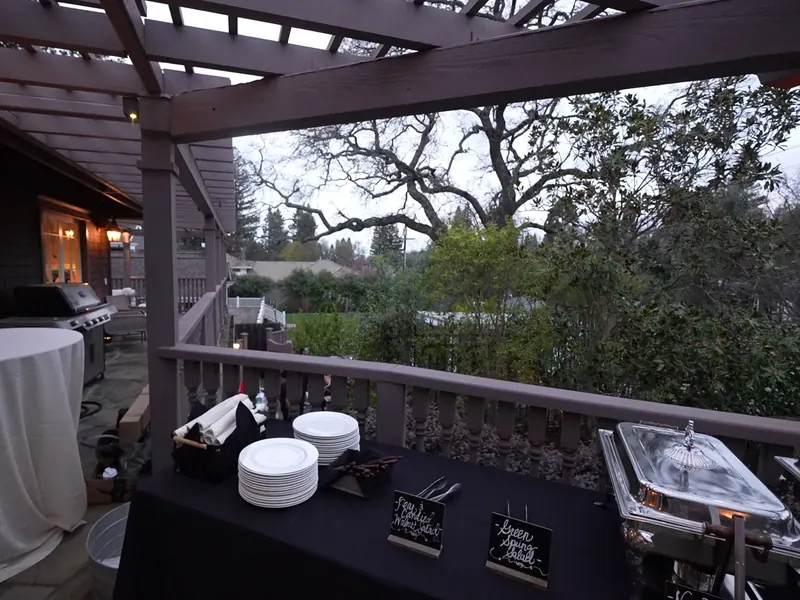 Covered deck buffet with chafing dishes at a Concord home