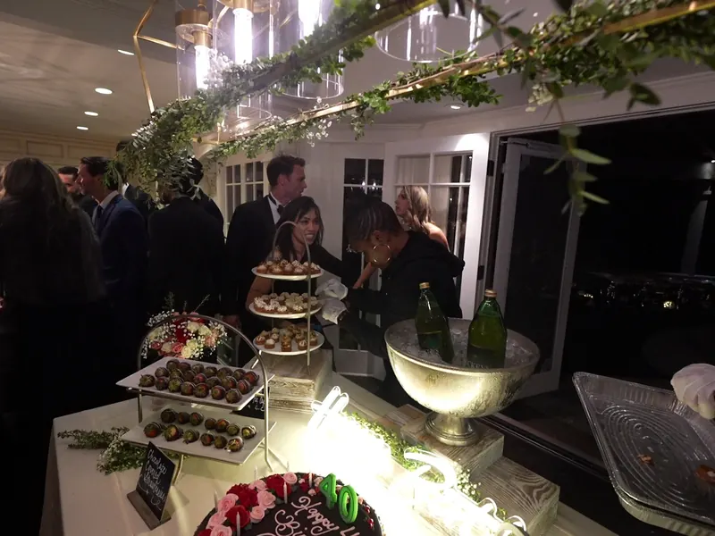 Tiered dessert display and chilled champagne at an indoor Walnut Creek party