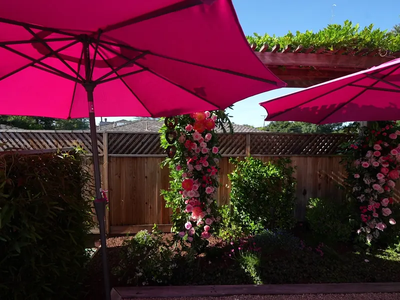 Shaded seating beside a flowering garden wall in Diablo
