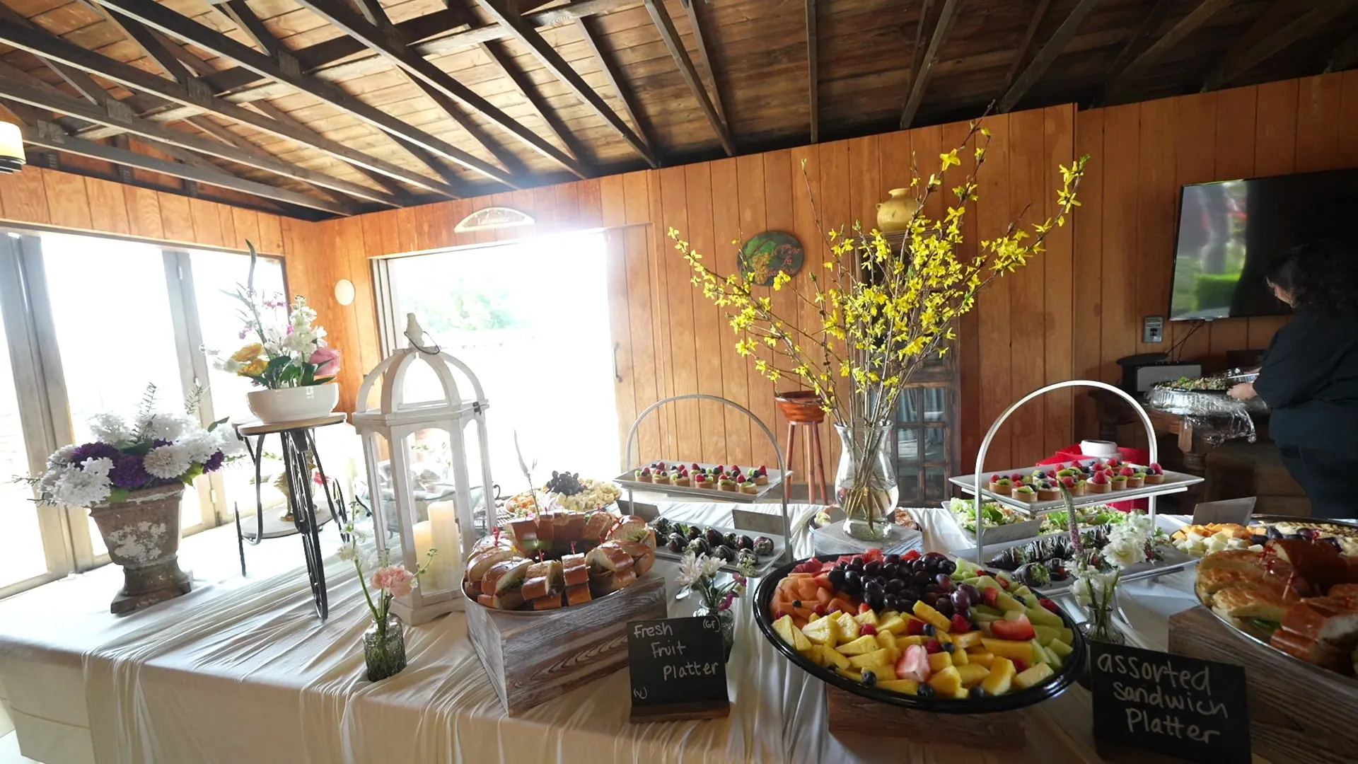 Pastry and fresh fruit platters set out for an Oakley brunch