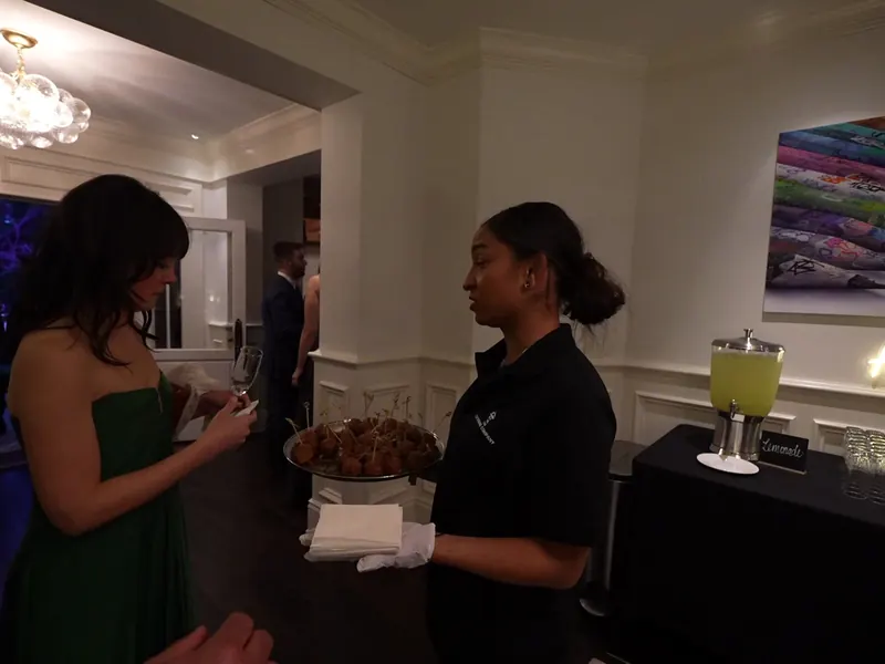 Server passing appetizers indoors at a Pittsburg celebration